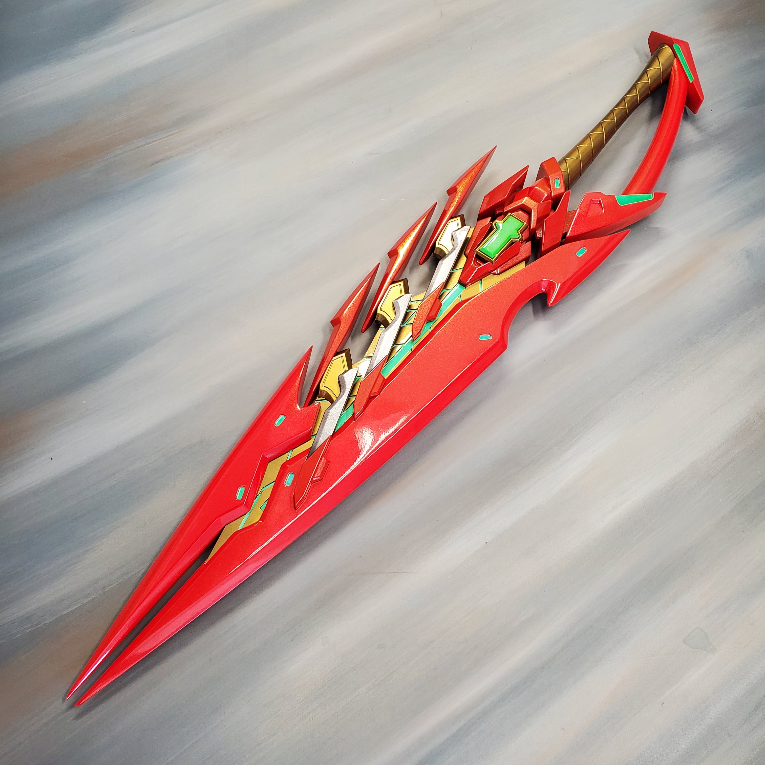 Red and gold fantasy sword on a gray background