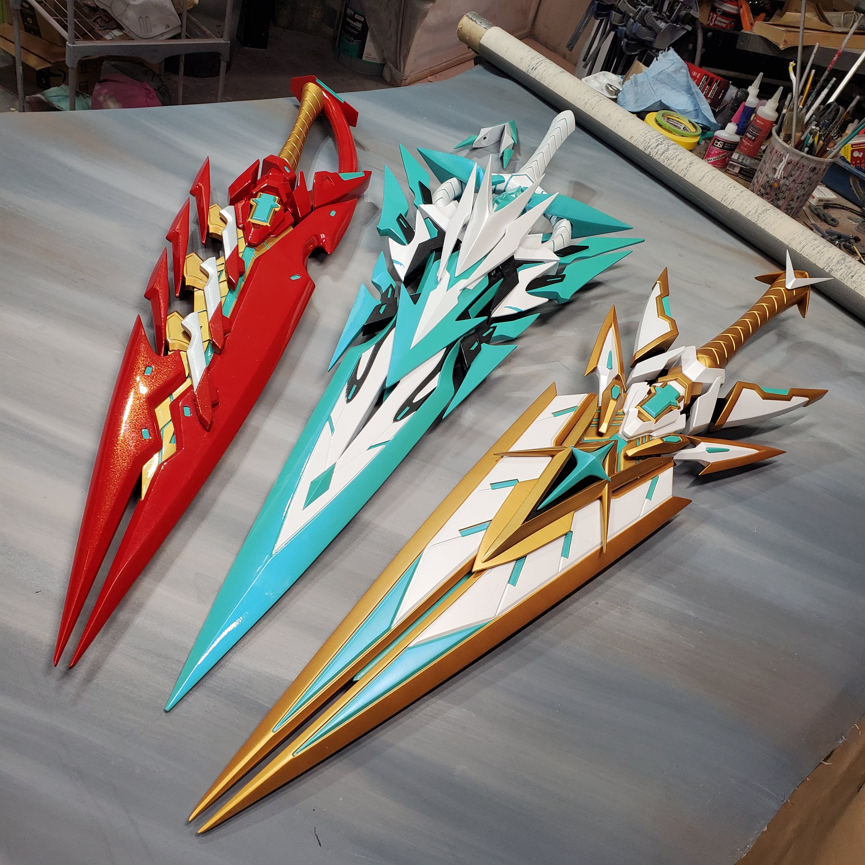 Colorful sword models on a gray surface